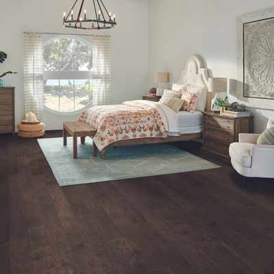 dark hardwood flooring in bedroom